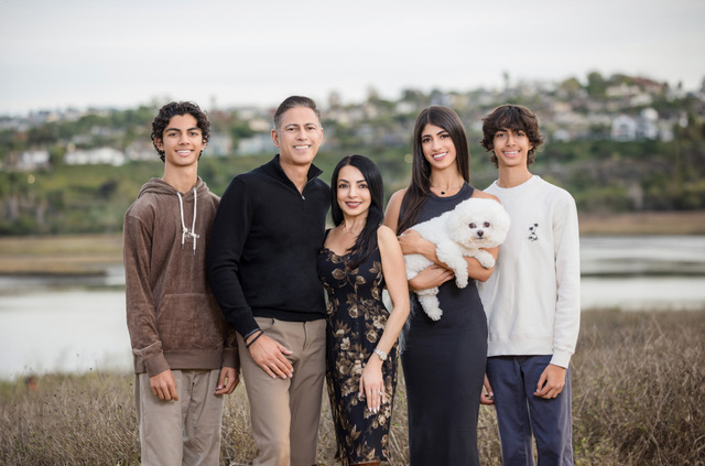 Dr. Sanjay Grover with his wife Nina, their three children Karina, Davin, and Dillan, and their puppy Bijoux