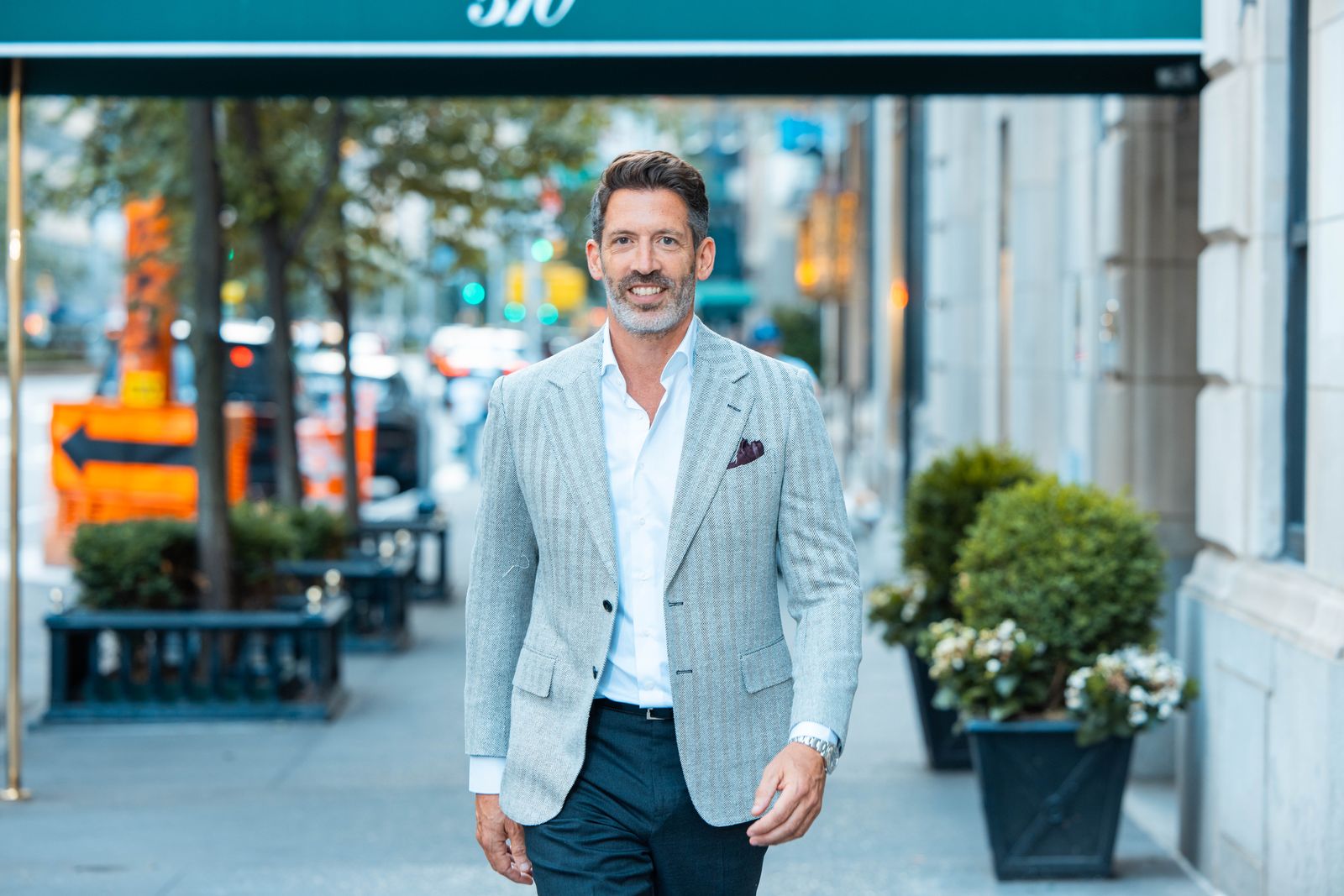Dr. David Cangello walking outside his Cangello Plastic Surgery practice on East 60th Street in midtown Manhattan